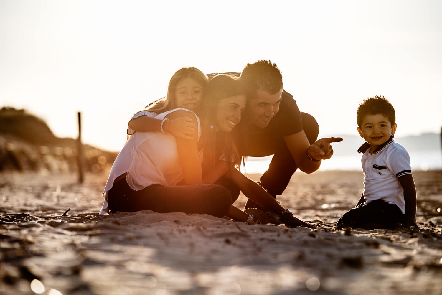 Family photo on the beach near sassari